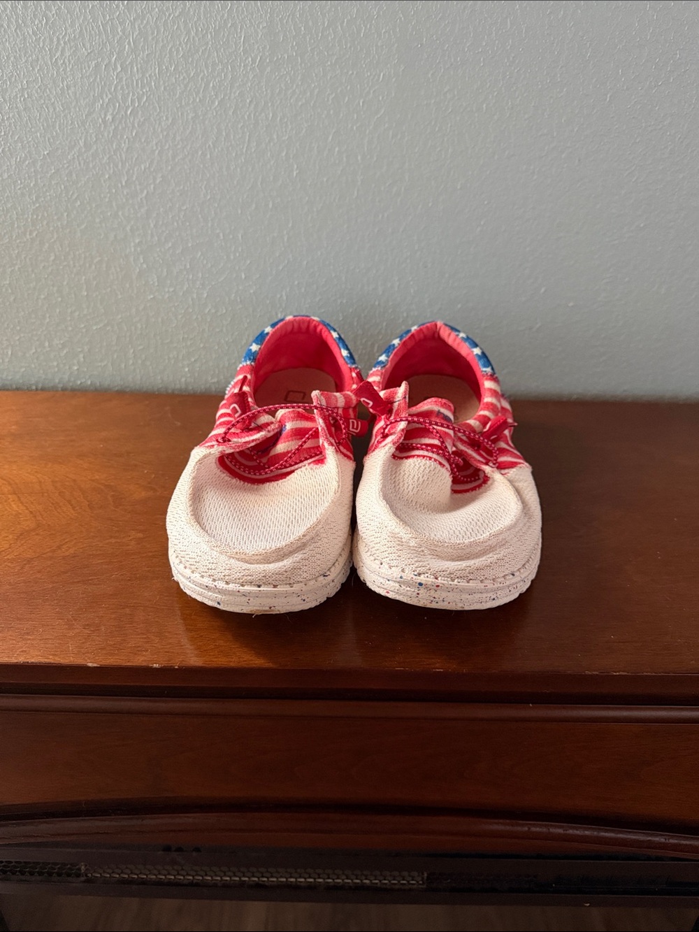 Hey Dude women’s red white and blue slip ons